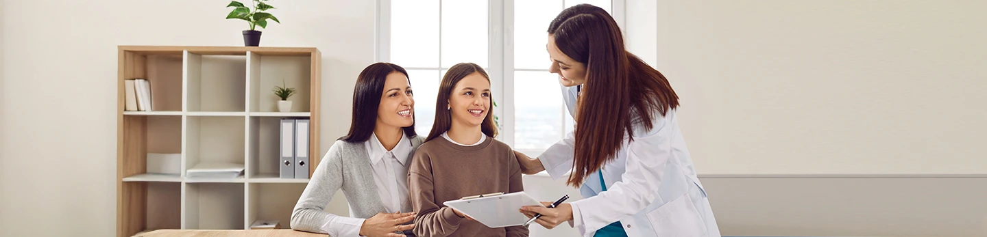 Mom Daughter Talking with Doctor