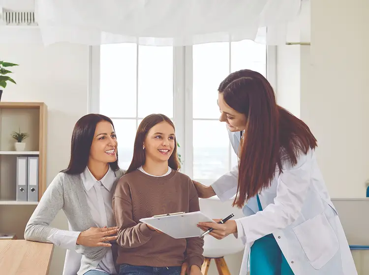 Mom Daughter Talking with Doctor